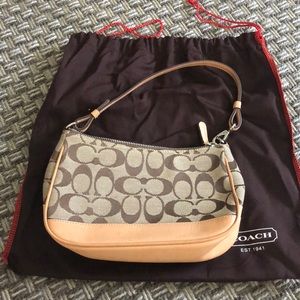 Large wristlet/small purse. Brown coach signature